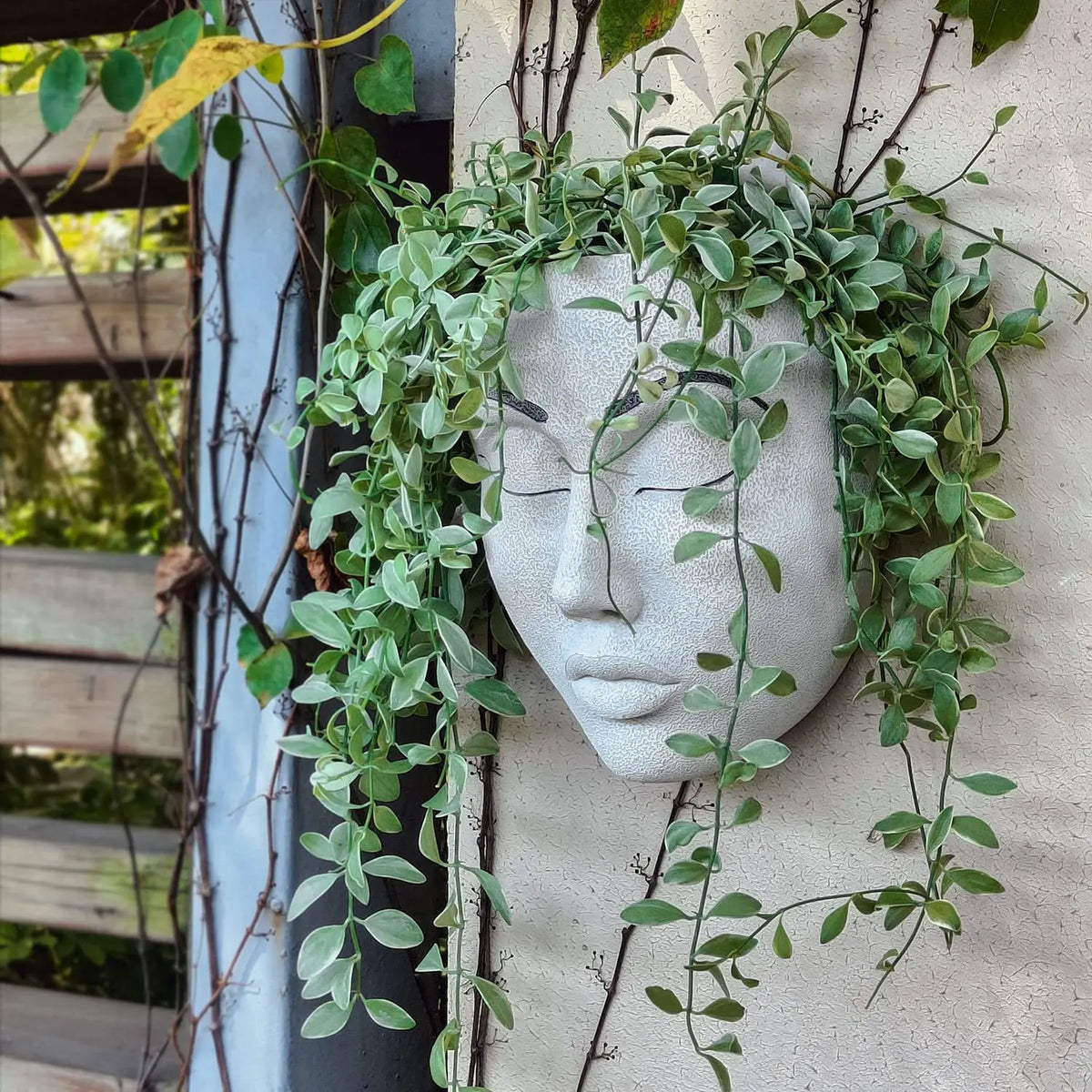 Ornamental Planter Featuring Fierce Human Face Design
