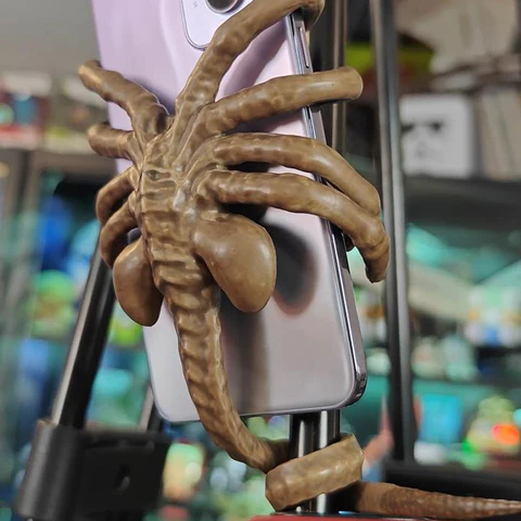 Quirky Alien Embrace Phone Stand