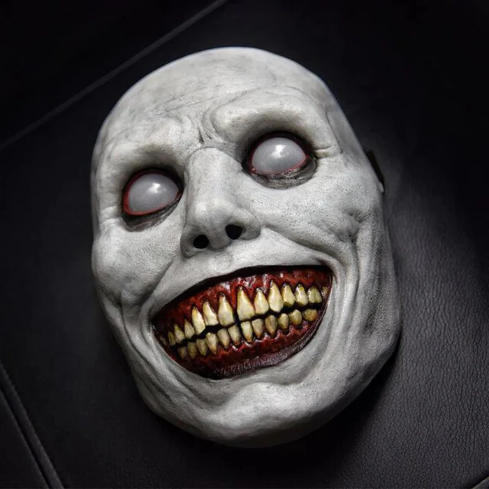 Chilling Grinning Demon Mask - Eerie White-Eyed Horror Face