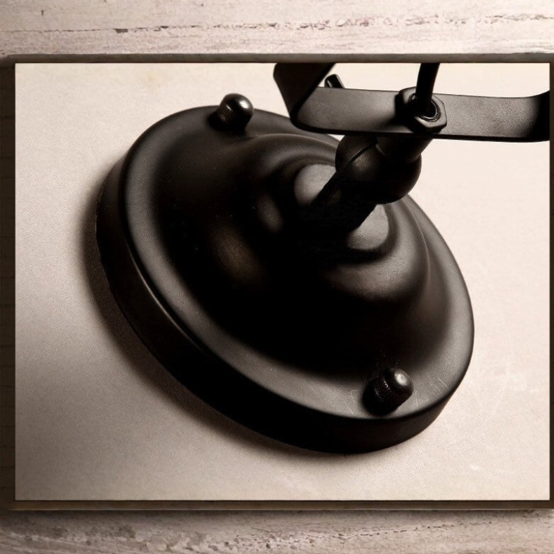 Versatile Wrought Iron Wall Light with Adjustable Arm